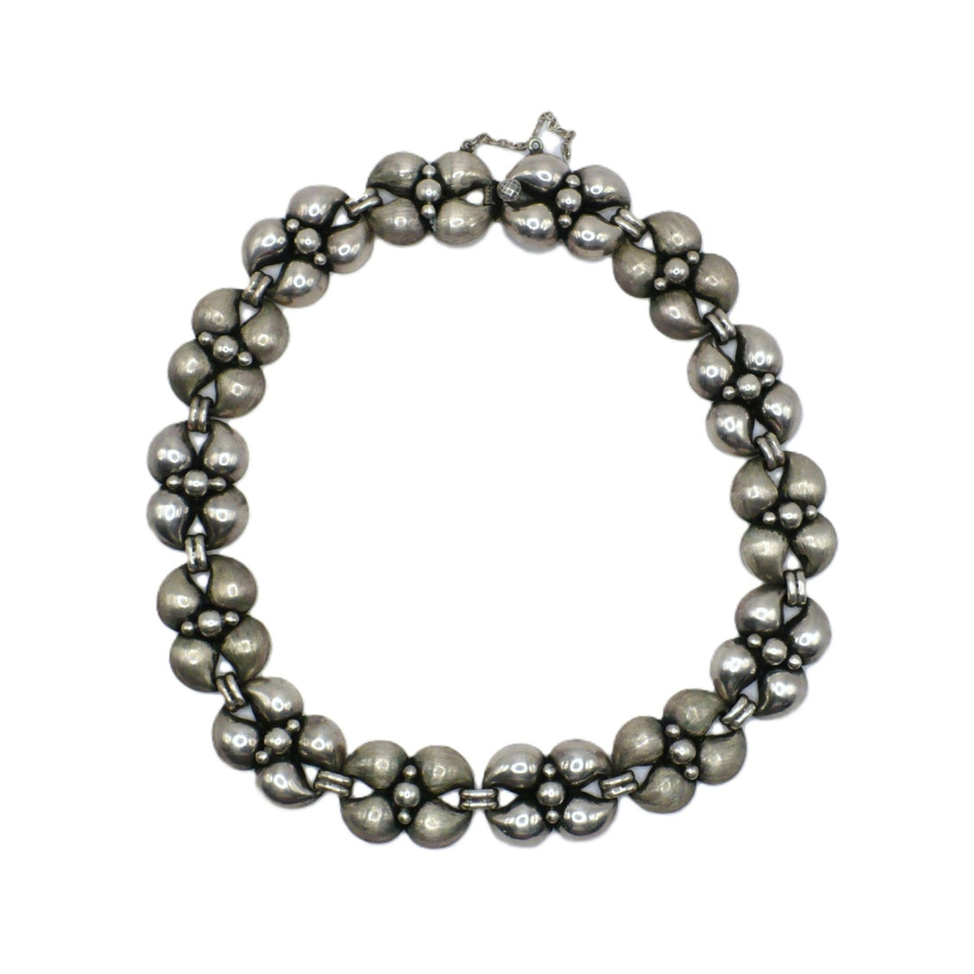 1950s Vintage Silver Modernist Industria Argentina Choker Necklace laying flat on white background.