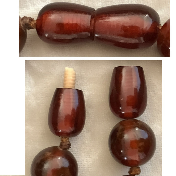 Vintage barrel clasp and terminal beads of an authentic 1920s cherry amber necklace.