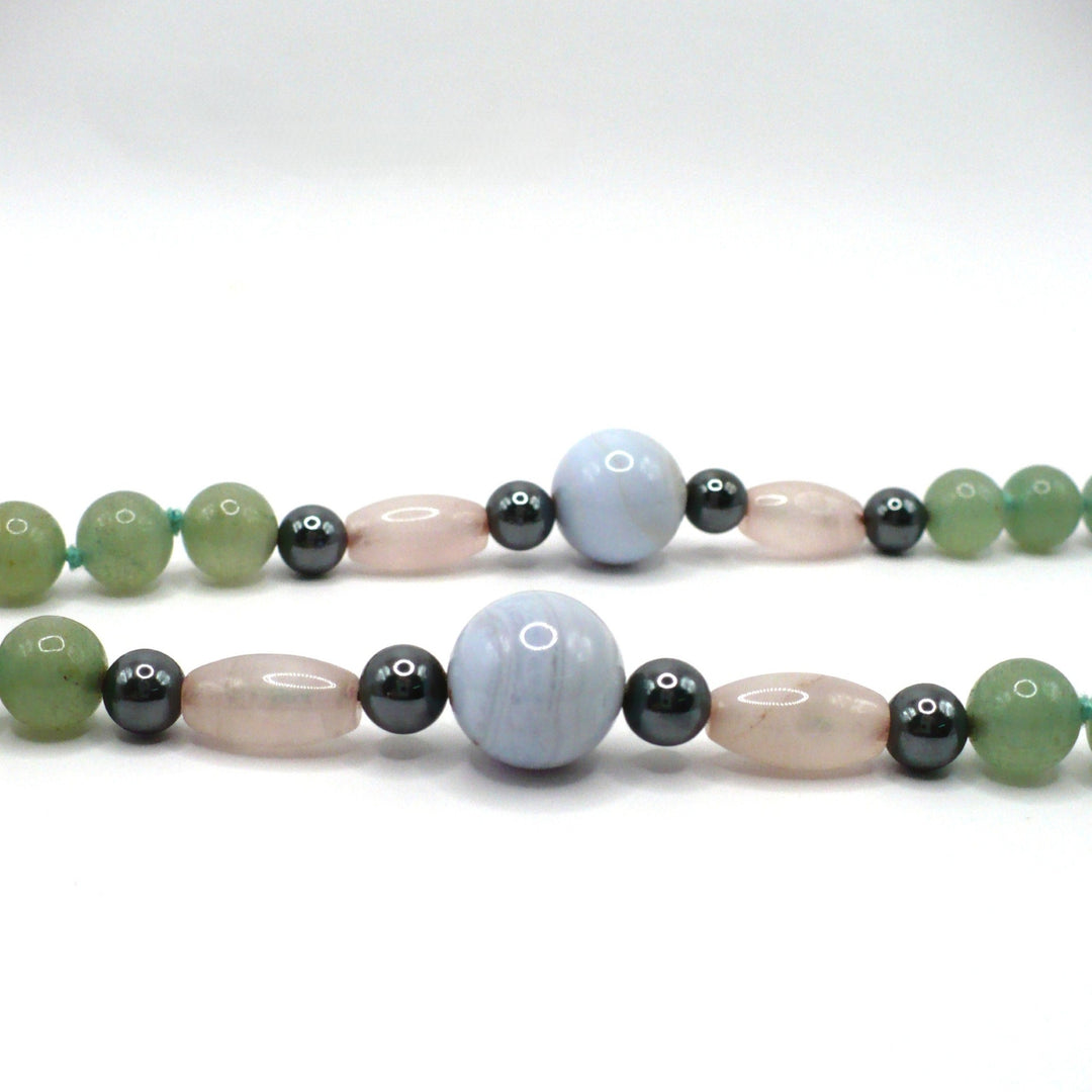 Close up of lace agate, rose quartz, hematite and aventurine beaded necklace.