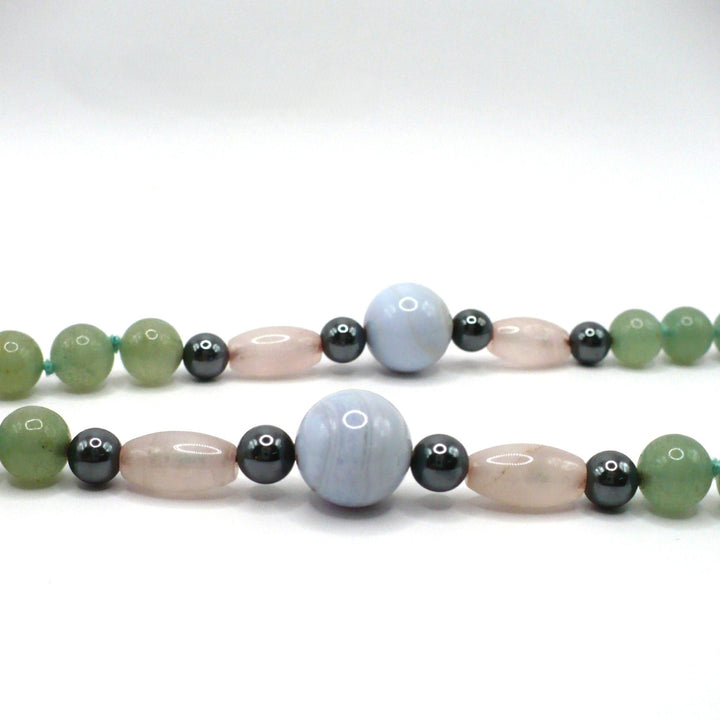 Close up of lace agate, rose quartz, hematite and aventurine beaded necklace.