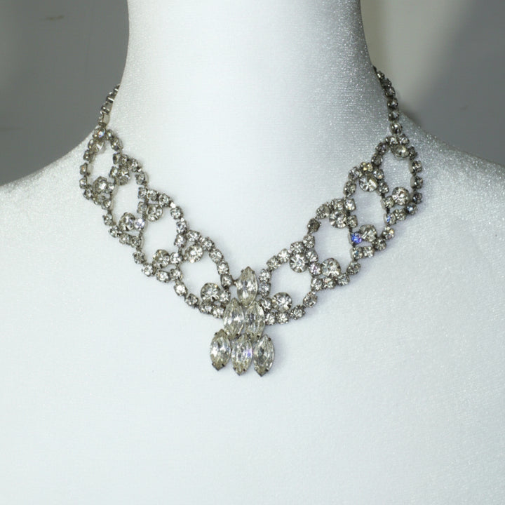 1950s Vintage Rhinestone Burlesque Bib Necklace on dress form.