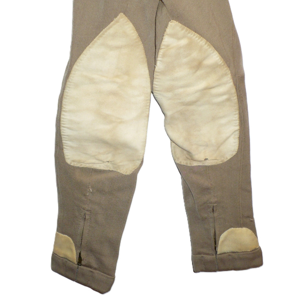 A close-up of  pair of children's vintage equestrian breeches inner knee patches and hems.