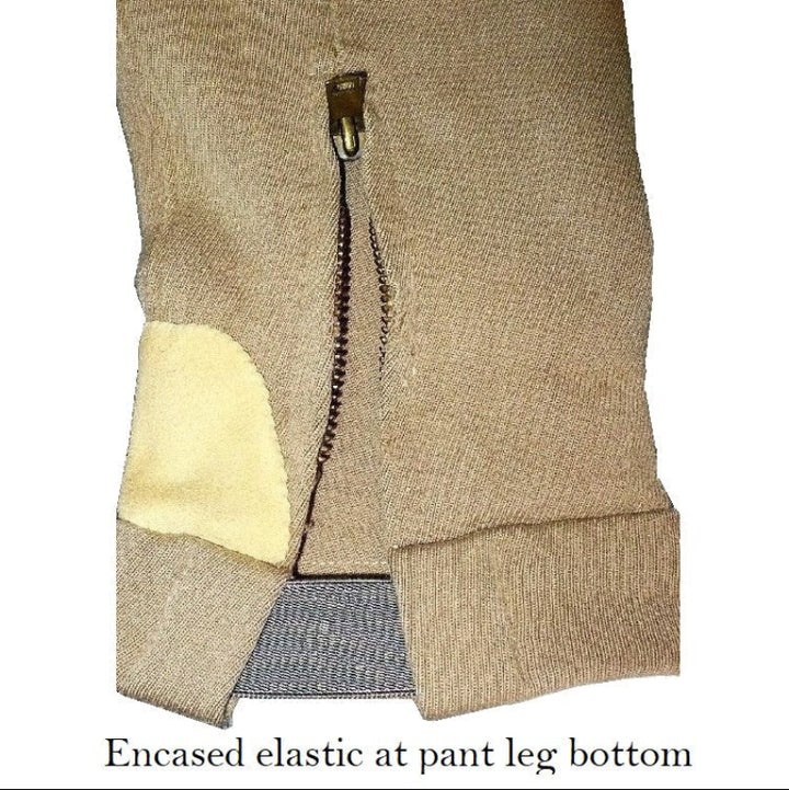 A close-up of  pair of children's vintage equestrian breeches ankles show zipper and elastic.