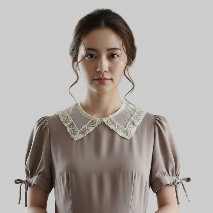 Woman wearing a brown dress with a 1800s Victorian Silk Mesh Lace Collar against a plain background