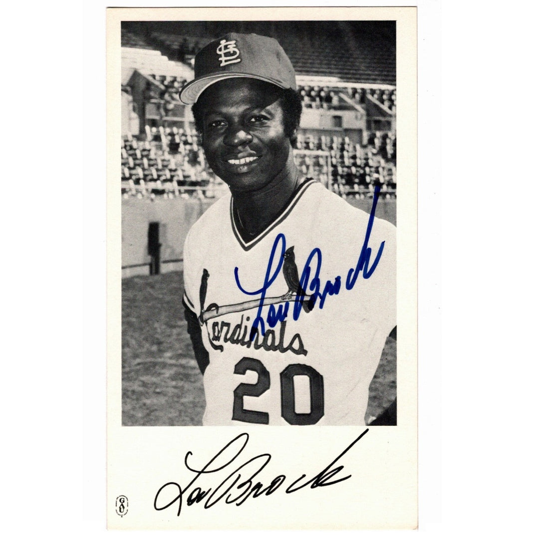 A vintage 1979 team-issued  black-and-white photograph featuring Lou Brock of the St. Louis Cardinals, signed in blue ink across the photo and with his signature printed at the bottom.