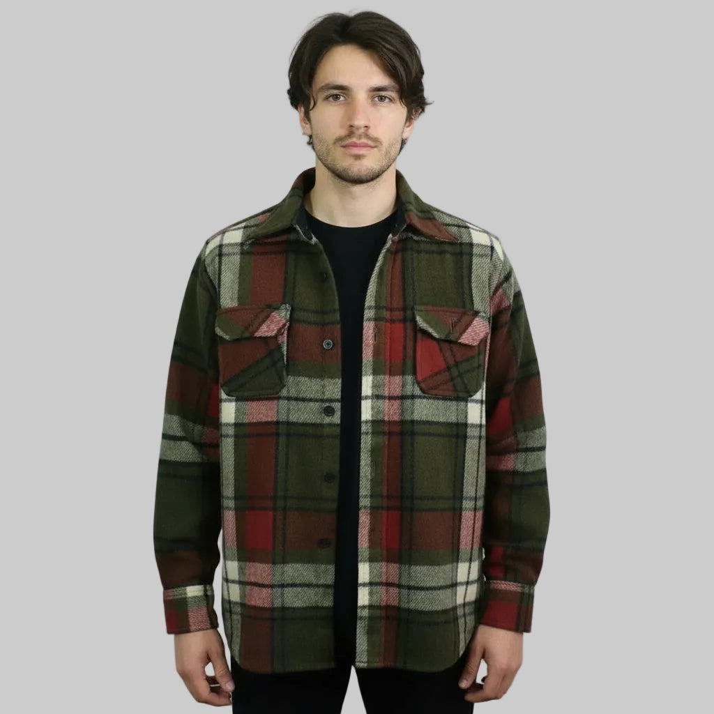 Man wearing a p1960s Vintage Shacket Plaid Wool Jacket on a gray background