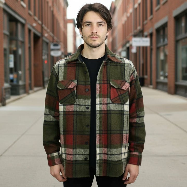Man wearing a 1960s Vintage Shacket Plaid Wool Jacket in an urban setting.