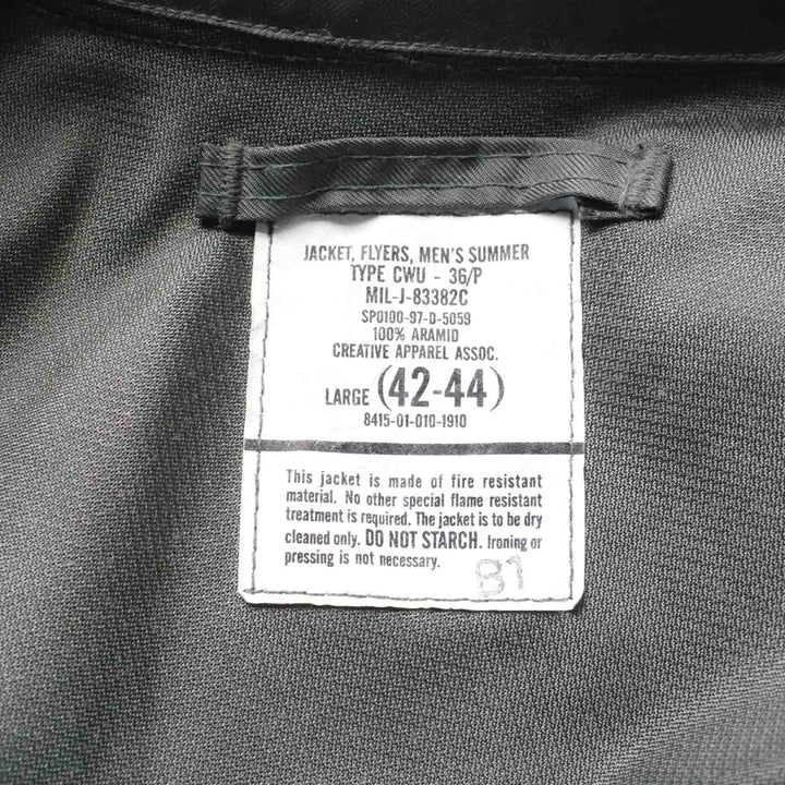 Label on a jacket indicating size and material details -1997 Vintage CWU-36/P Military Summer Flight Jacket 42 44 Large USAF.