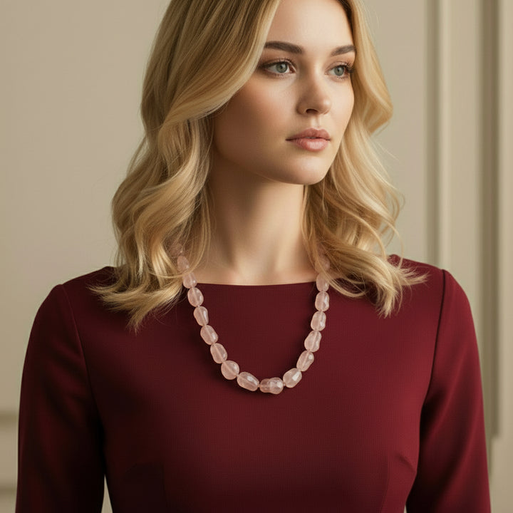 1980s Rose Quartz Nugget Bead Necklace 25", on woman wearing red dress.