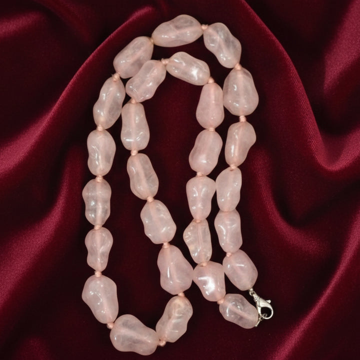 1980s Rose Quartz Nugget Bead Necklace 25", on velvet fabric.