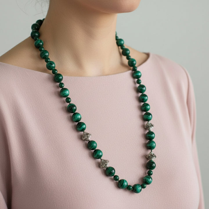 Vintage Green Malachite Beaded Gemstone Necklace with Silver Accents  shown on model with pink blouse.