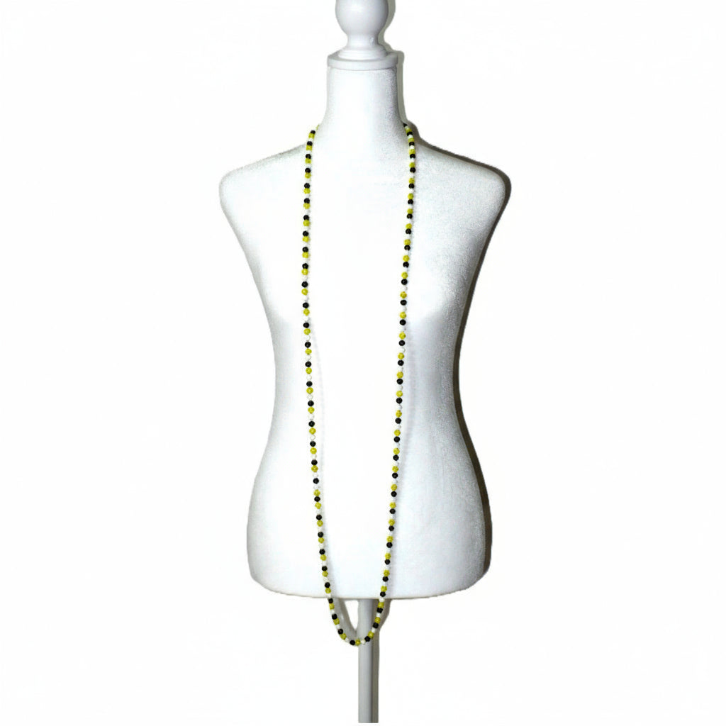 1920s Vintage Long  Glass Beaded Lampwork Flapper Necklace on dress form.