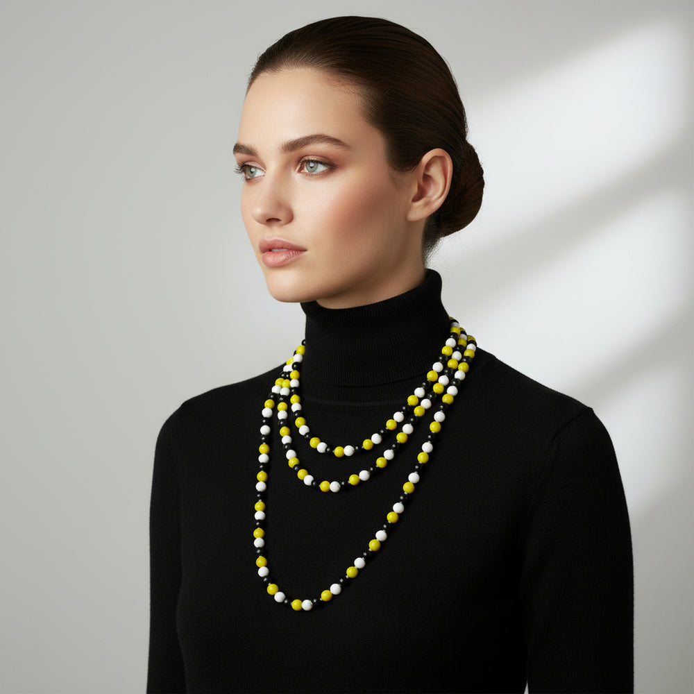 1920s Vintage Long  Glass Beaded Lampwork Flapper Necklace wrapped to make three tier necklace on woman in black turtleneck.