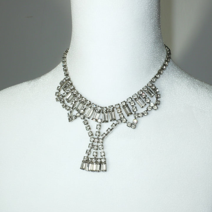 1950s Vintage Art Deco Rhinestone Festoon Necklace on dress form.