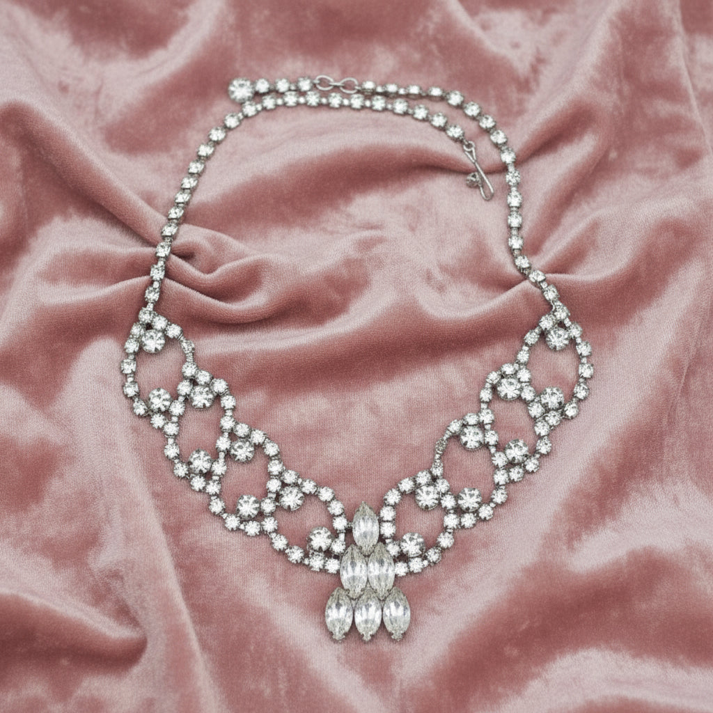 1950s Vintage Rhinestone Burlesque or Prom, stage Bib Necklace, front view on fabric.
