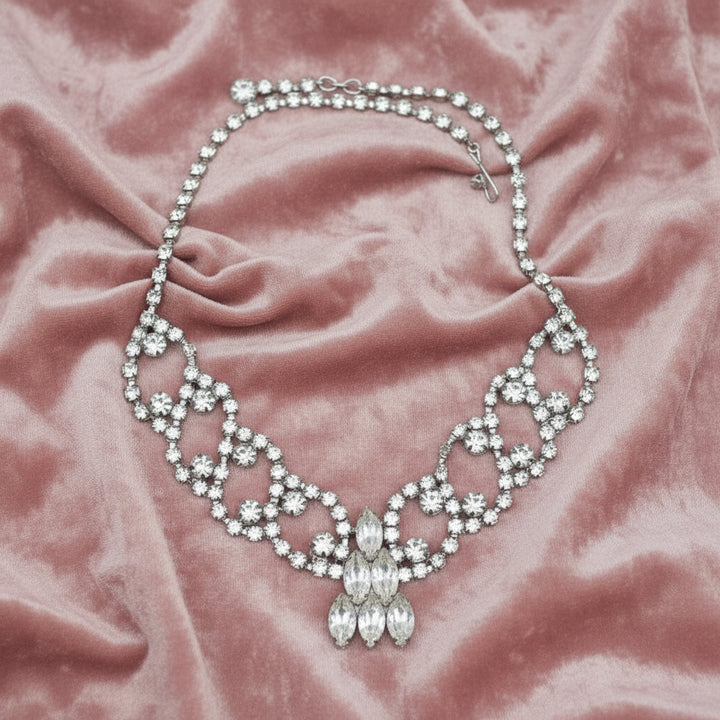 1950s Vintage Rhinestone Burlesque or Prom, stage Bib Necklace, front view on fabric.