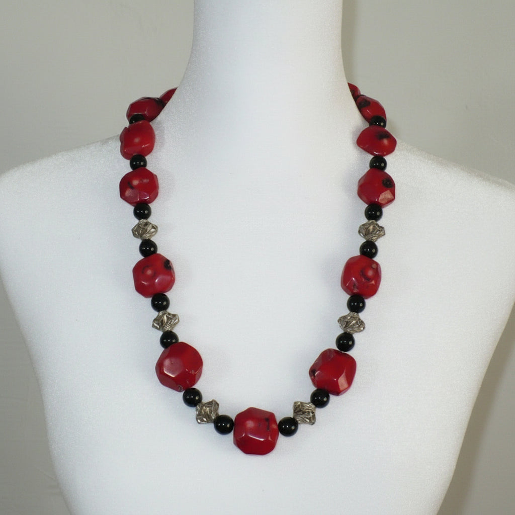 1970s Vintage Red Bamboo Coral Nugget, Black Onyx, and silver Bead Necklace on dress form.
