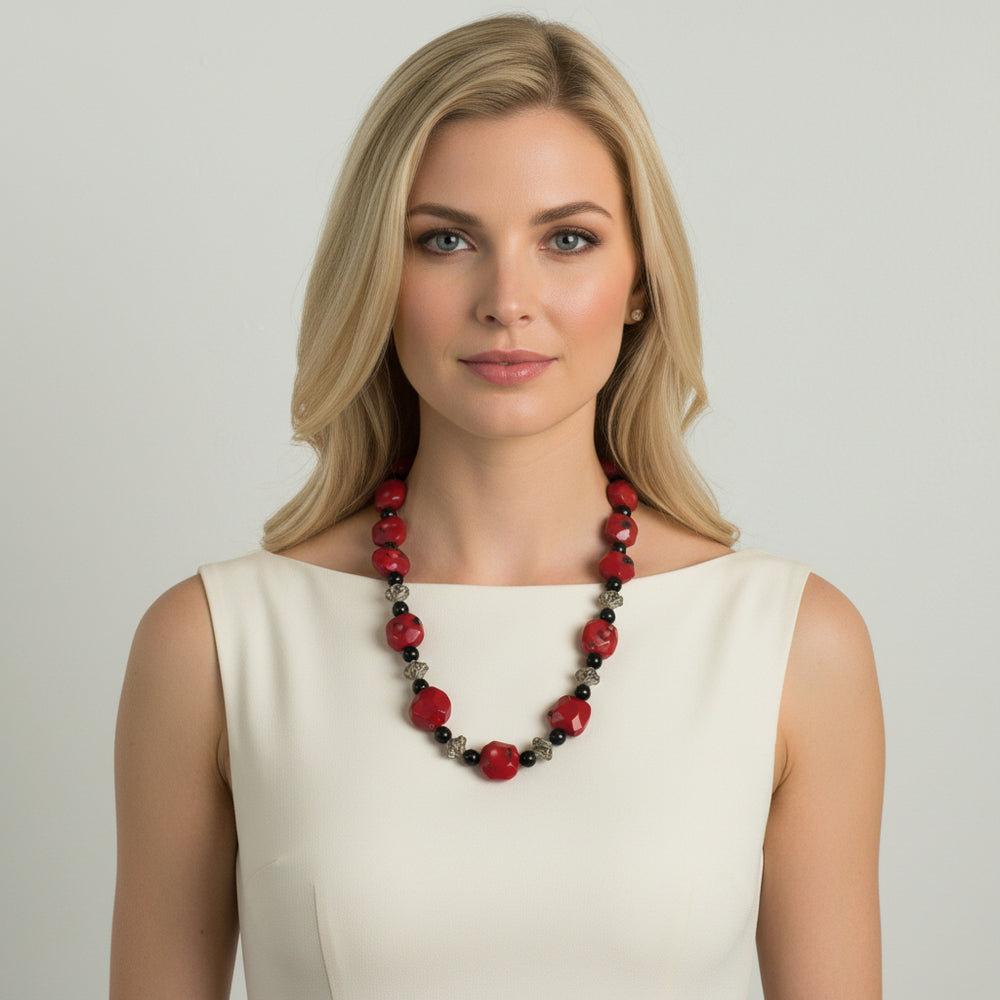 1970s Vintage Red Bamboo Coral Nugget, Black Onyx, and silver Bead Necklace on woman.