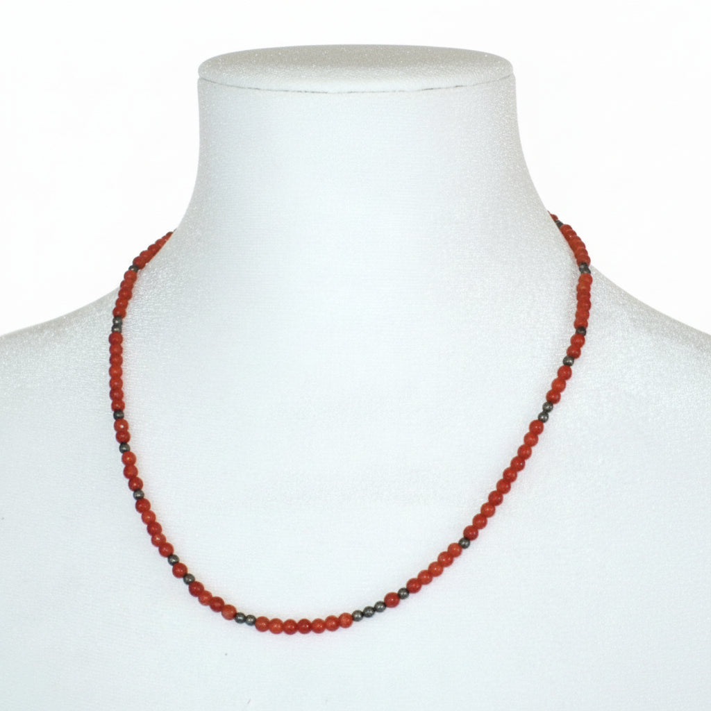 1970s Vintage Coral & Hematite beaded  Necklace. on dress form, front view.