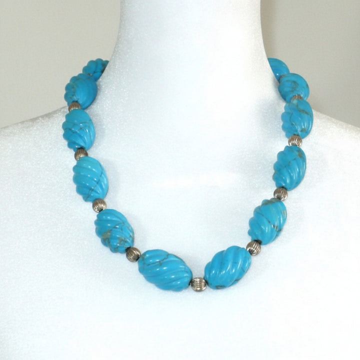 1970s Vintage Blue Howlite and silver beaded Necklace on dress form.