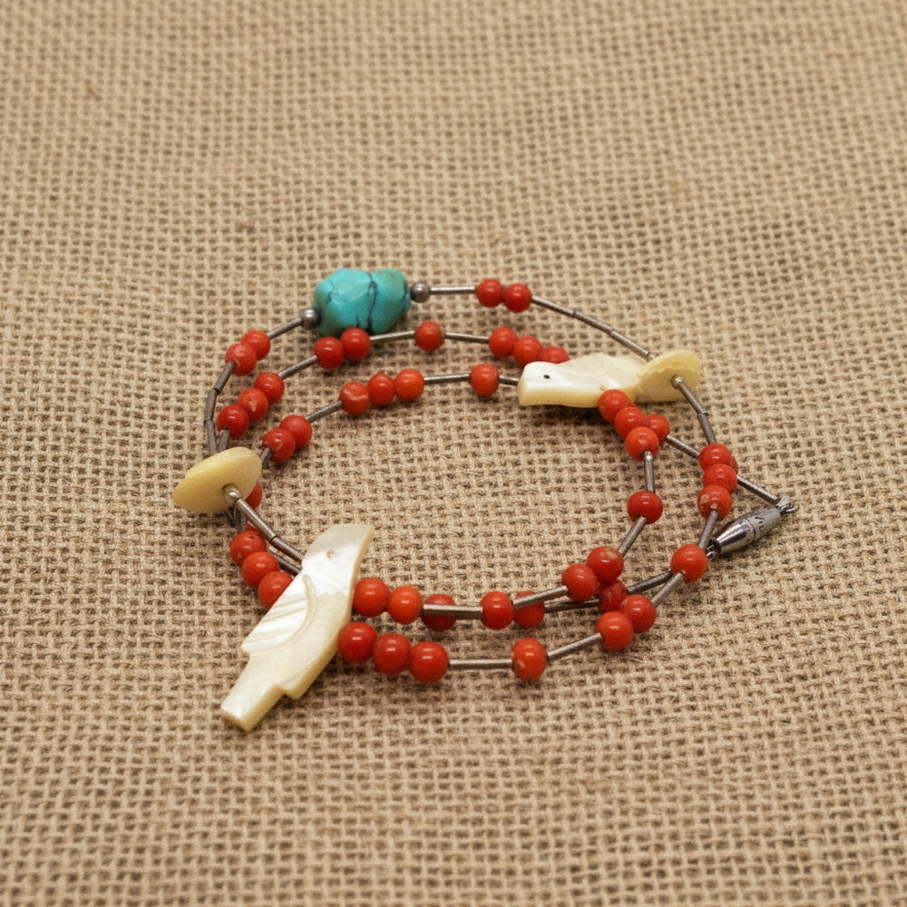 1960s Vintage Red Coral Howlite and Shell Bird Fetish Beaded Necklace on burlap fabric.
