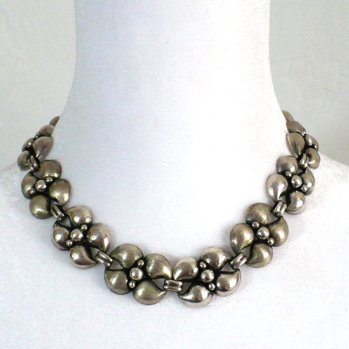 1950s Vintage Silver Modernist Industria Argentina Choker Necklace worn on white dress form neck.