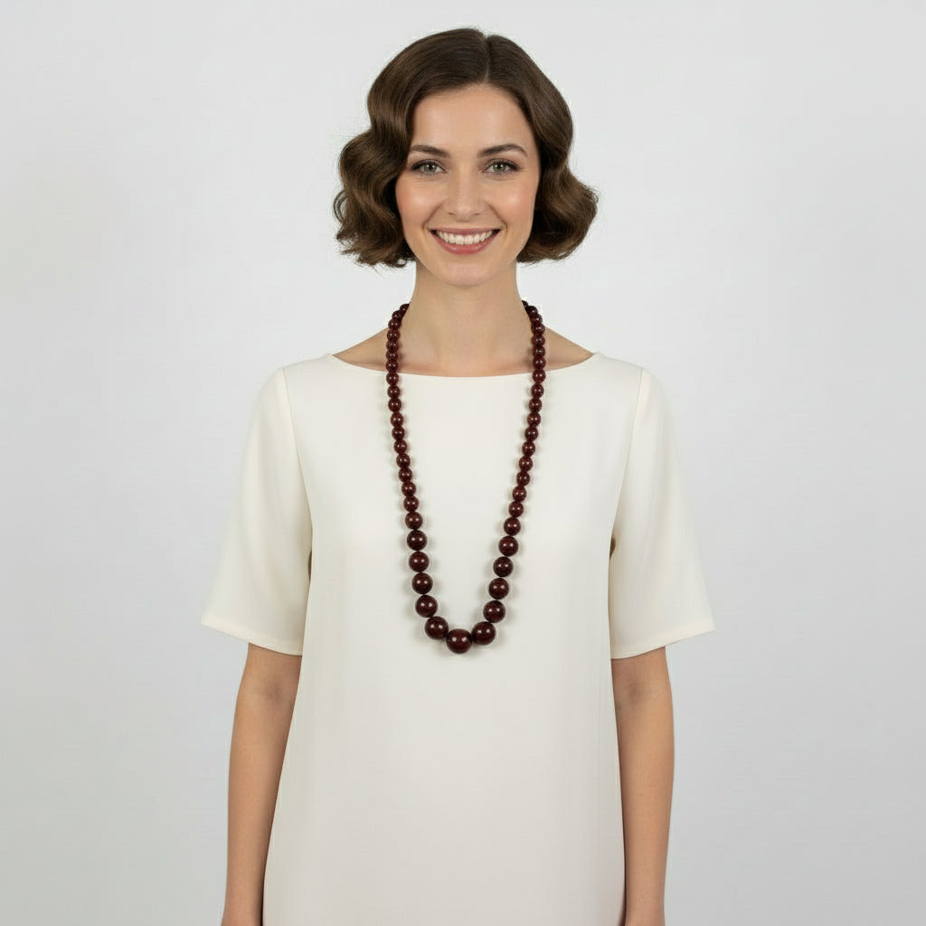 Edwardian to 1920s Vintage Cherry Amber Beaded Necklace shown on woman.