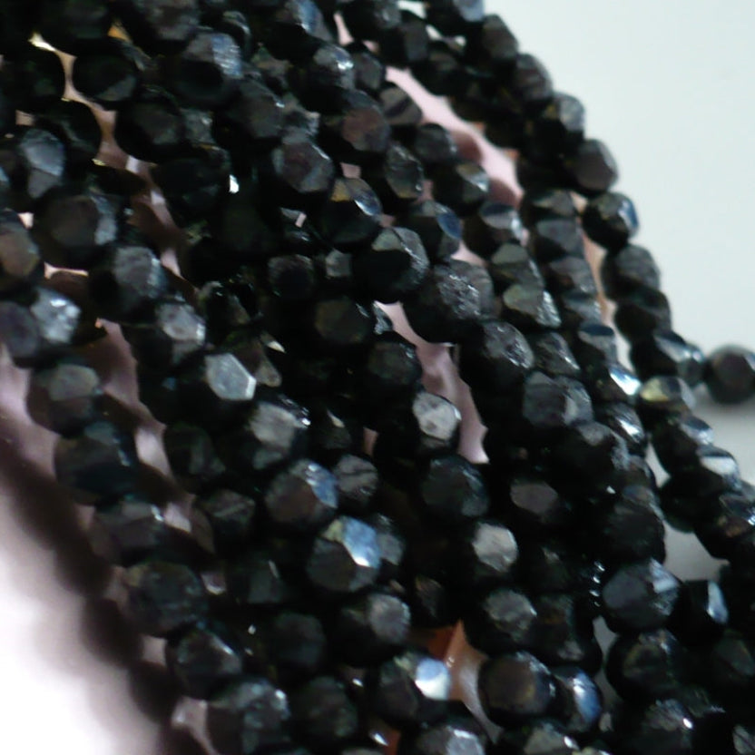 1960s 3.5mm Mini Hanks Black Garnet Faceted Beads, close-up view 2.