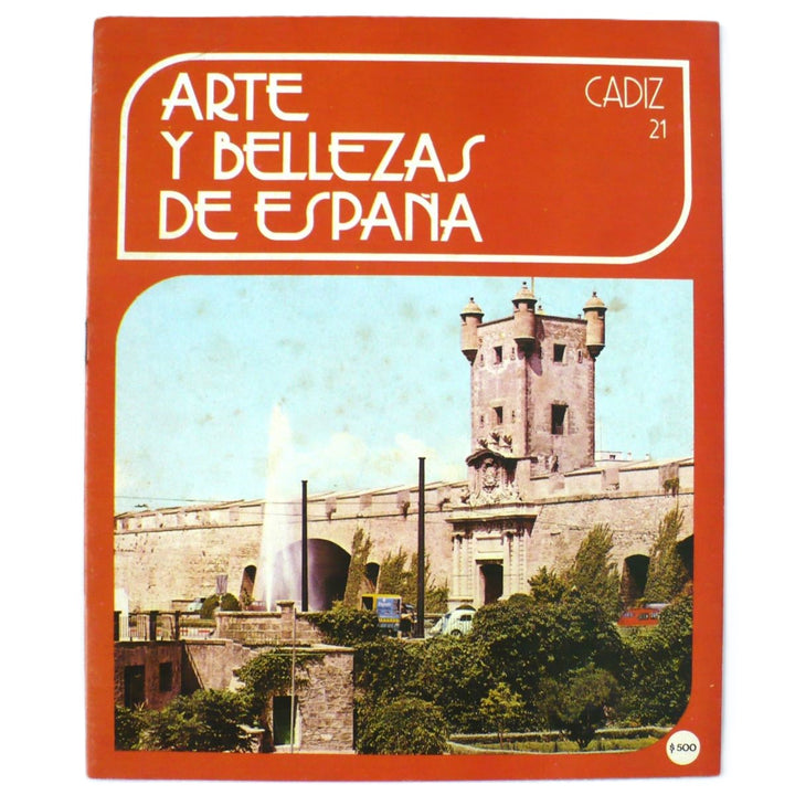 The cover of the book 'Arte Y Bellezas De España Volumen 21 Cadiz 1976' featuring a color photograph of a cathedral, with the title and an illustration of a castle in the background.