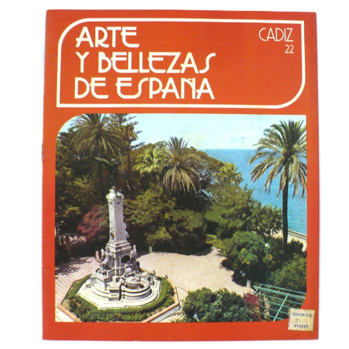 The cover of the book 'Arte Y Bellezas De España Volumen 22 Cadiz 1976' featuring a photograph of a fountain in a park with palm trees in the background.