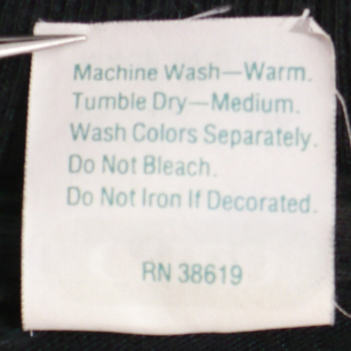 AC/DC Fly on The Wall Tour T-Shirt back side tag shows acre instructions also shared in description.