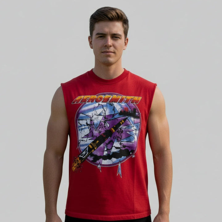 Person young man wearing a vintage Aerosmith shirt on a plain background