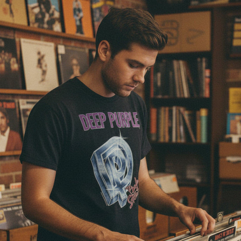 Man wearing a vintage Black t-shirt with Deep Purple logo and text in a used record store.