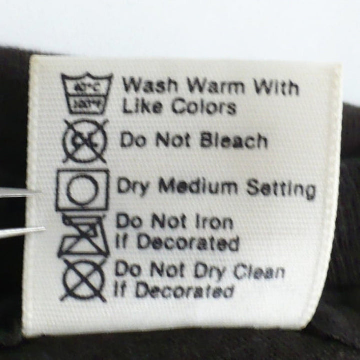 Back of label tag shows care instructions on  1985 Deep Purple Perfect Strangers Tour of T-Shirt.