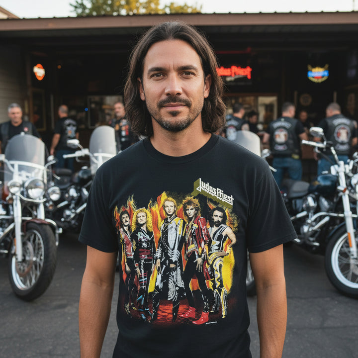Man wearing a blackVintage 1986 Band T-Shirt & Ticket Judas Priest Fuel For Life with  graphic in front, mororcycles in back.