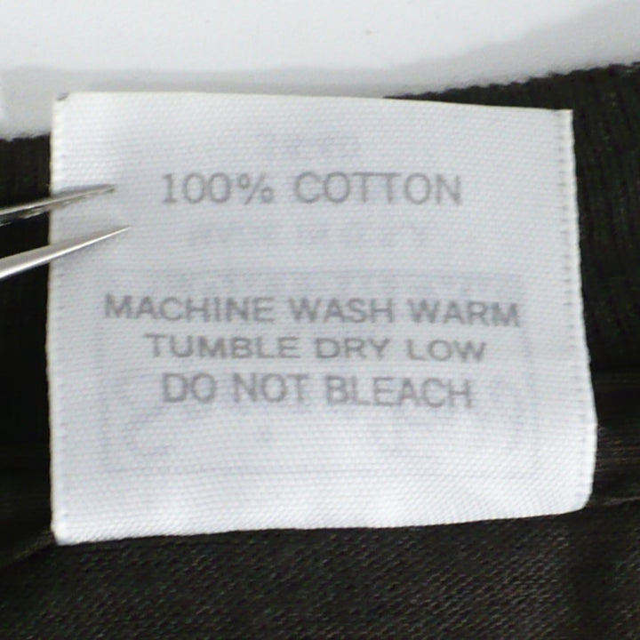 TNT Tell No Tales w/Stryper Tour T-Shirt care instructions on back of label.