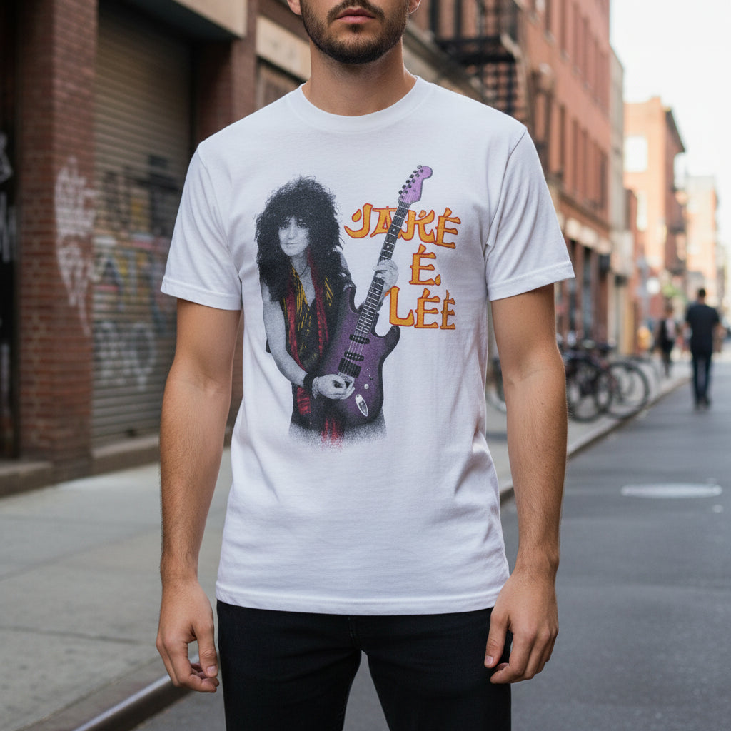 Vintage Jake E. Lee T-shirt on man with street scene behind him.