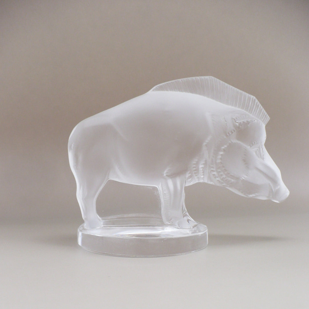 A frosted glass sculpture of Lalique Sanglier Bouchon de Radiateur: Wild Boar Car Mascot, right side view.