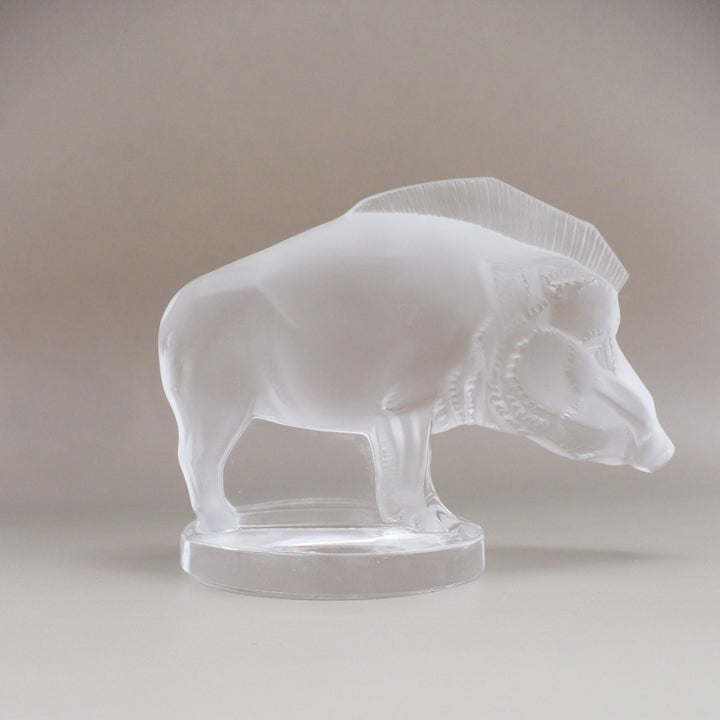 A frosted glass sculpture of Lalique Sanglier Bouchon de Radiateur: Wild Boar Car Mascot, right side view.