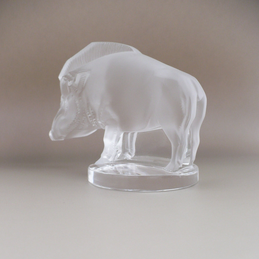 A frosted glass sculpture of Lalique Sanglier Bouchon de Radiateur: Wild Boar Car Mascot left 3/4 hind view.