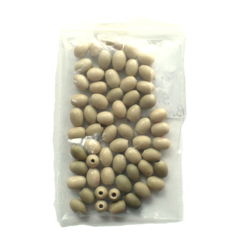 Batch 1910s 5x7mm Smooth Oval Vegetable Ivory Beads, in a plastic bag.