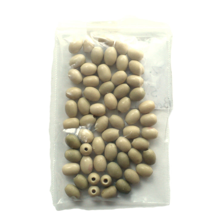 Batch 1910s 5x7mm Smooth Oval Vegetable Ivory Beads, in a plastic bag.