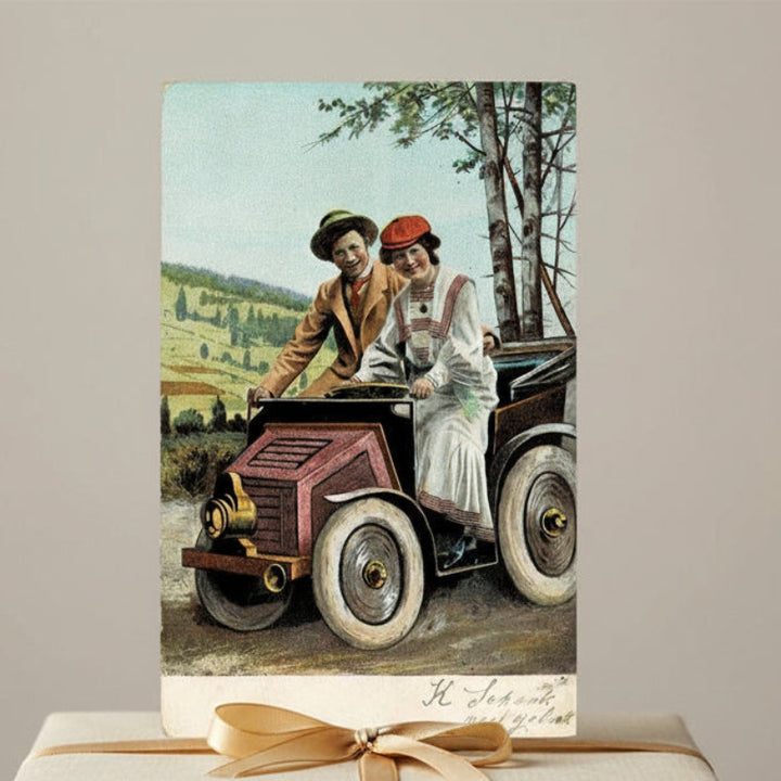 Antique, vintage Valentine, romance, or courtship postcard of couple in jalopy roadster.