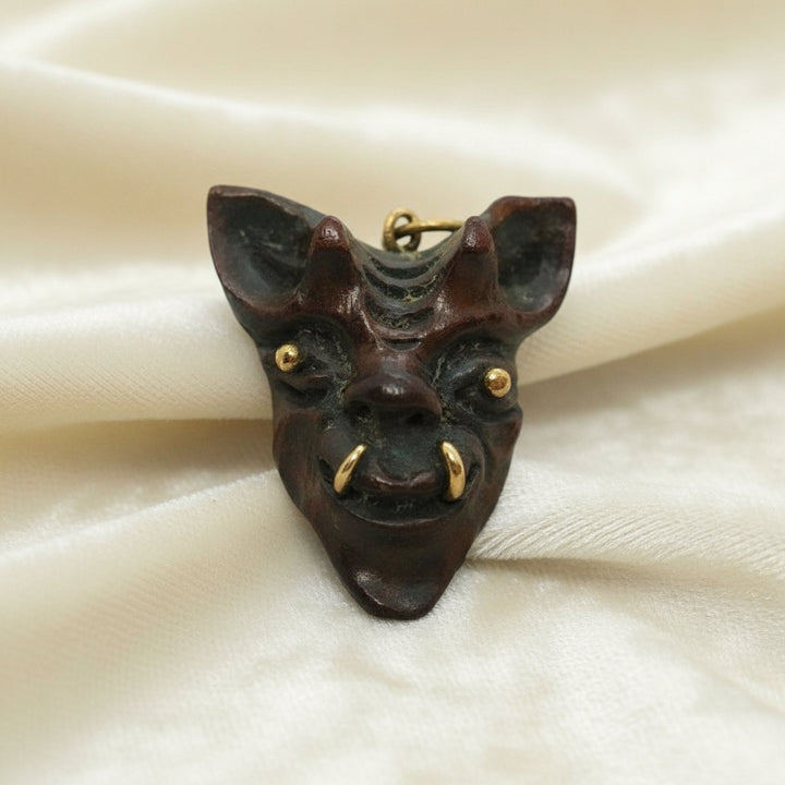 191960 Vintage Samurai Oni Hannya Mask Warthog Pendant with velvet background.