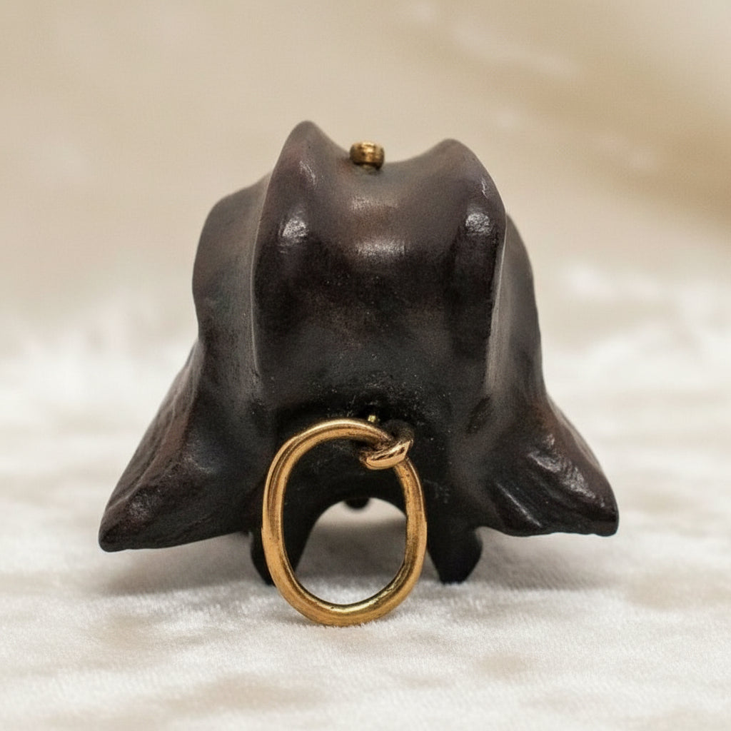 1960 Vintage Samurai Oni Hannya Mask Warthog Pendant with velvet background.