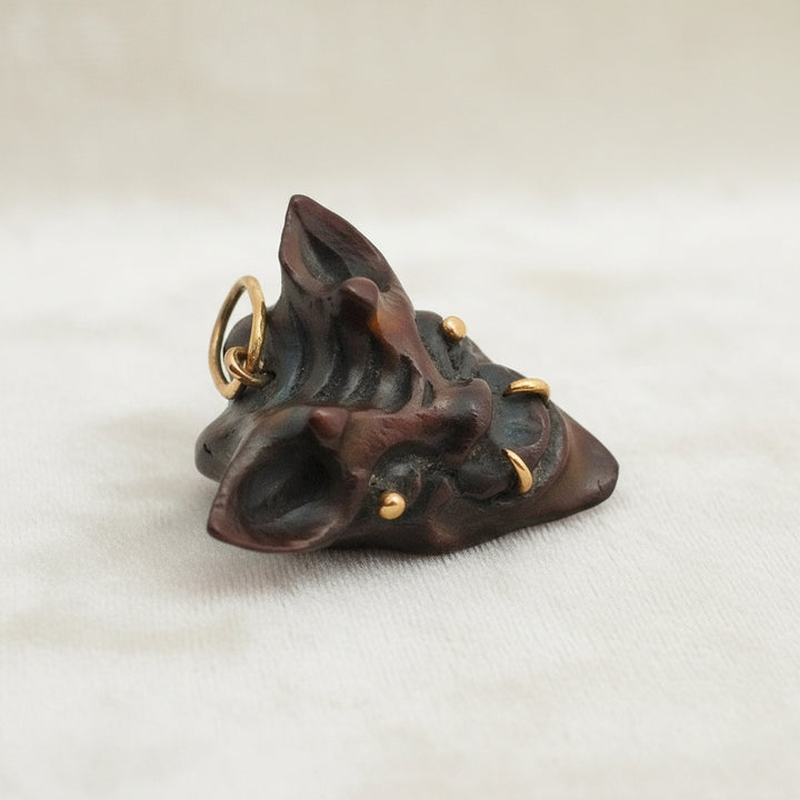 1960 Vintage Samurai Oni Hannya Mask Warthog Pendant with velvet background.