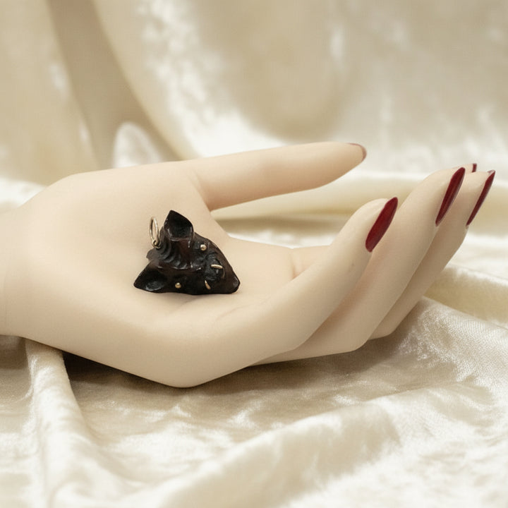 1960 Vintage Samurai Oni Hannya Mask Warthog Pendant= in hand with velvet background.