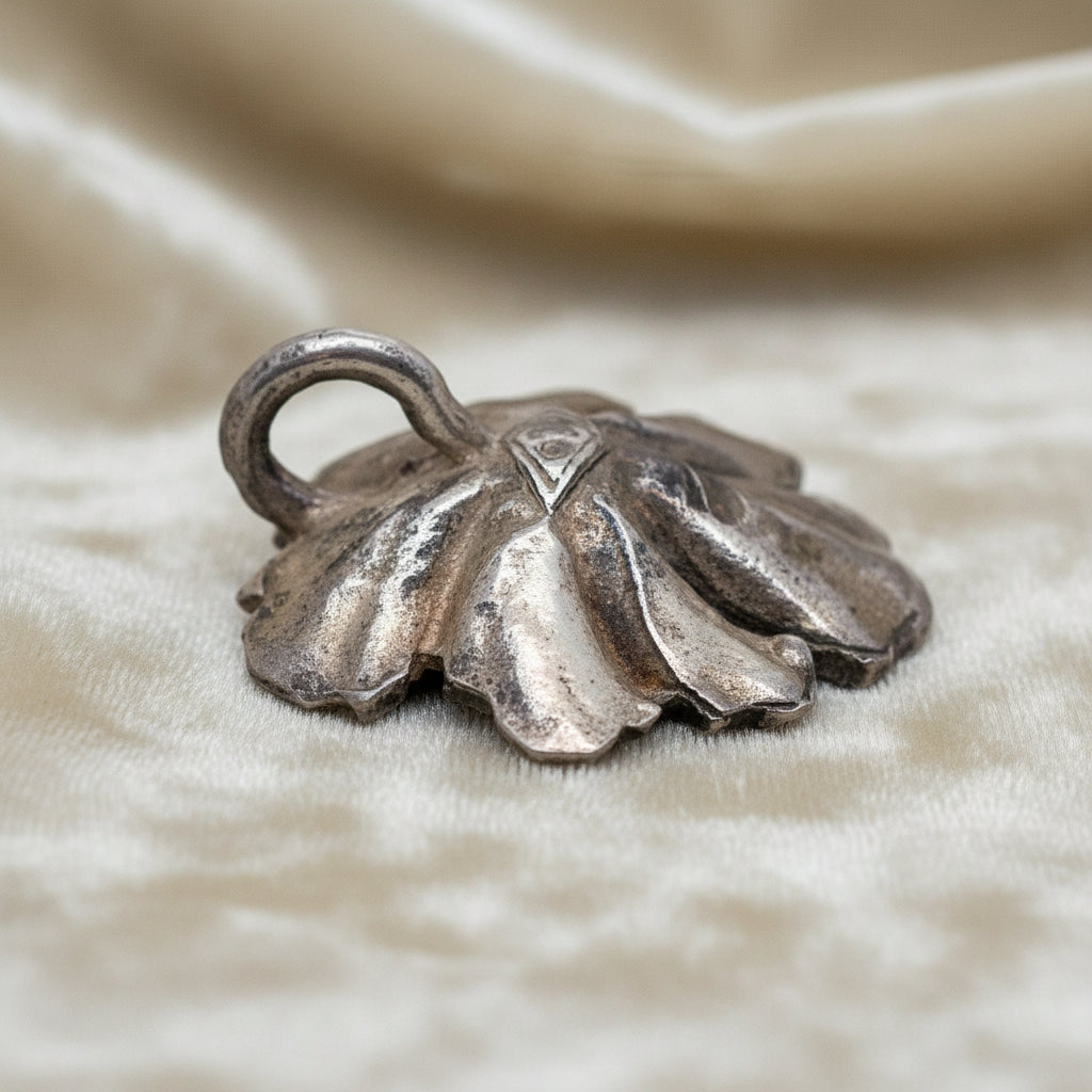 Silver Flower and Pearl Pendant on velvet ground.