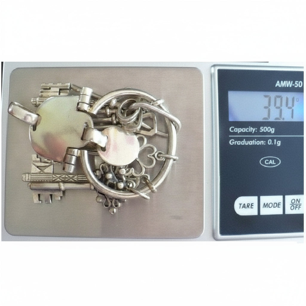 Sterling Silver Chatelaine Skeleton Keys Pendant, 1970s vintage on jewelry scale showing 39.4 gms weaght.