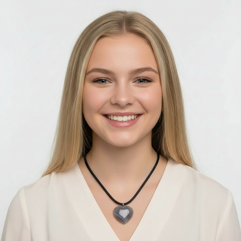 Grey banded agate carved heart pendant.